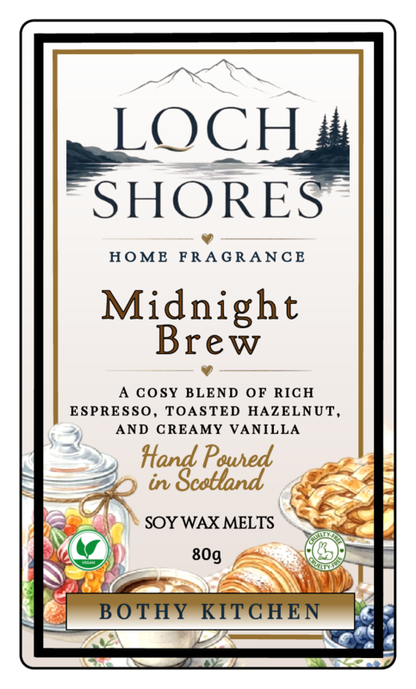 Front packaging of Loch Shores Home Fragrance Midnight Brew scent, a 80g soy wax melt by Bothy Kitchen. The cream-colored label features a black and white mountain lake illustration, product details, and illustrations of cozy foods like croissants, scones, and fruit on a white background with a black and gold border.