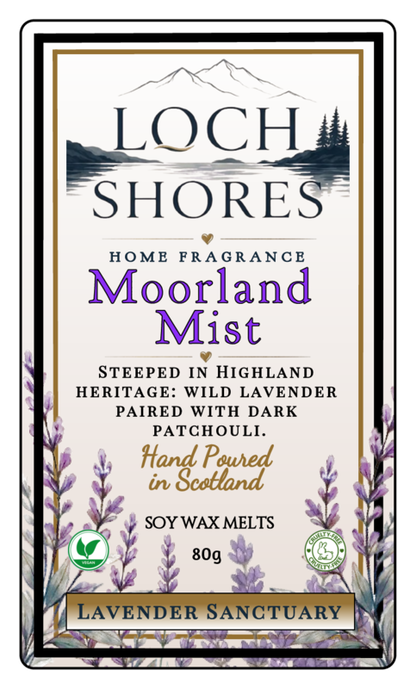 Front-facing product label for Loch Shores Home Fragrance 'Moorland Mist' soy wax melts, featuring a cream background with black and purple typography, mountain and lake artwork, lavender illustrations, and a border.